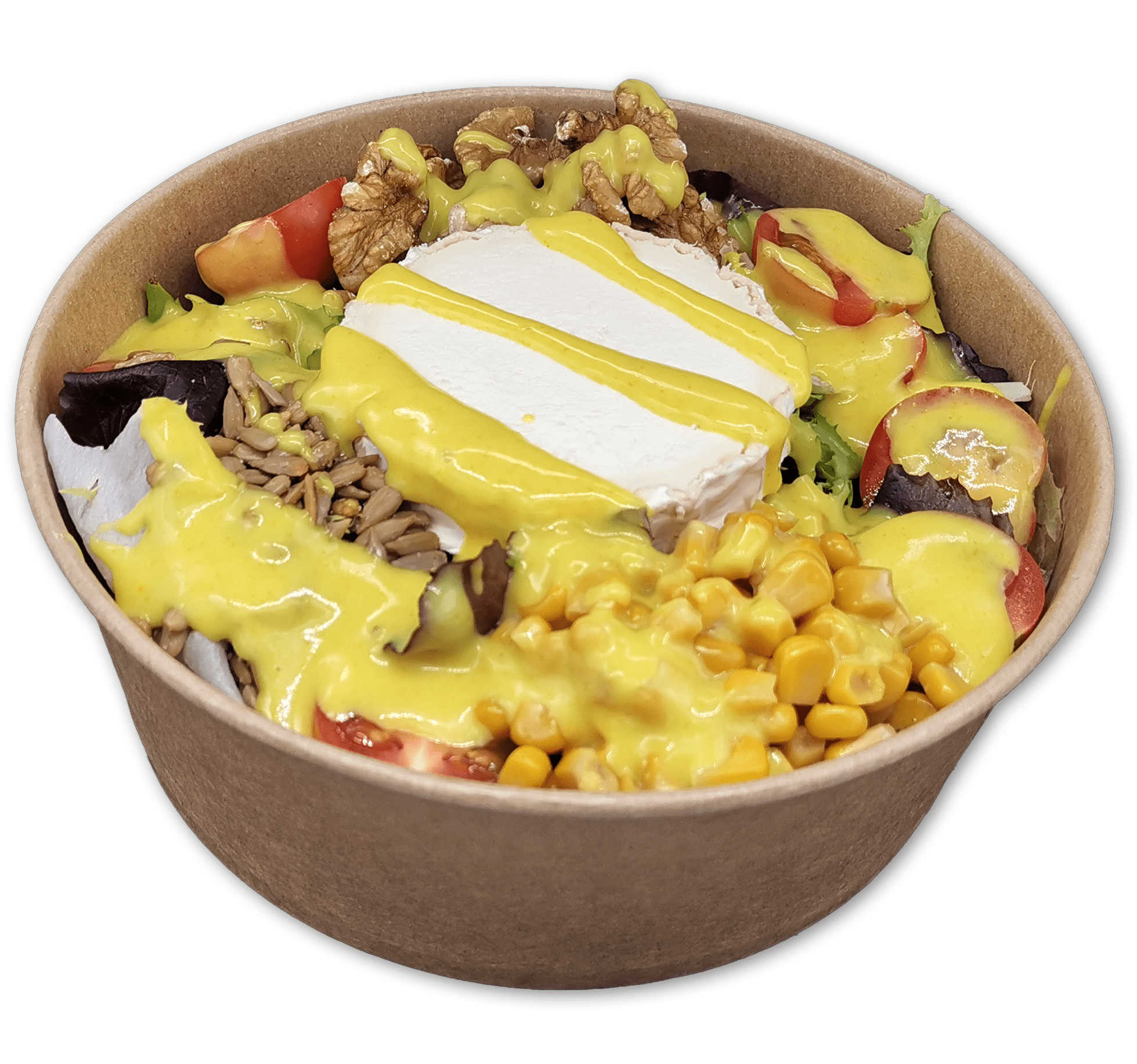 La Ensalada Rulo de Cabra, servida en un recipiente redondo de papel marrón, contiene verduras mixtas, tomates, maíz dulce, semillas de girasol, nueces y una rodaja de queso Rulo de Cabra cubierto con aderezo amarillo.