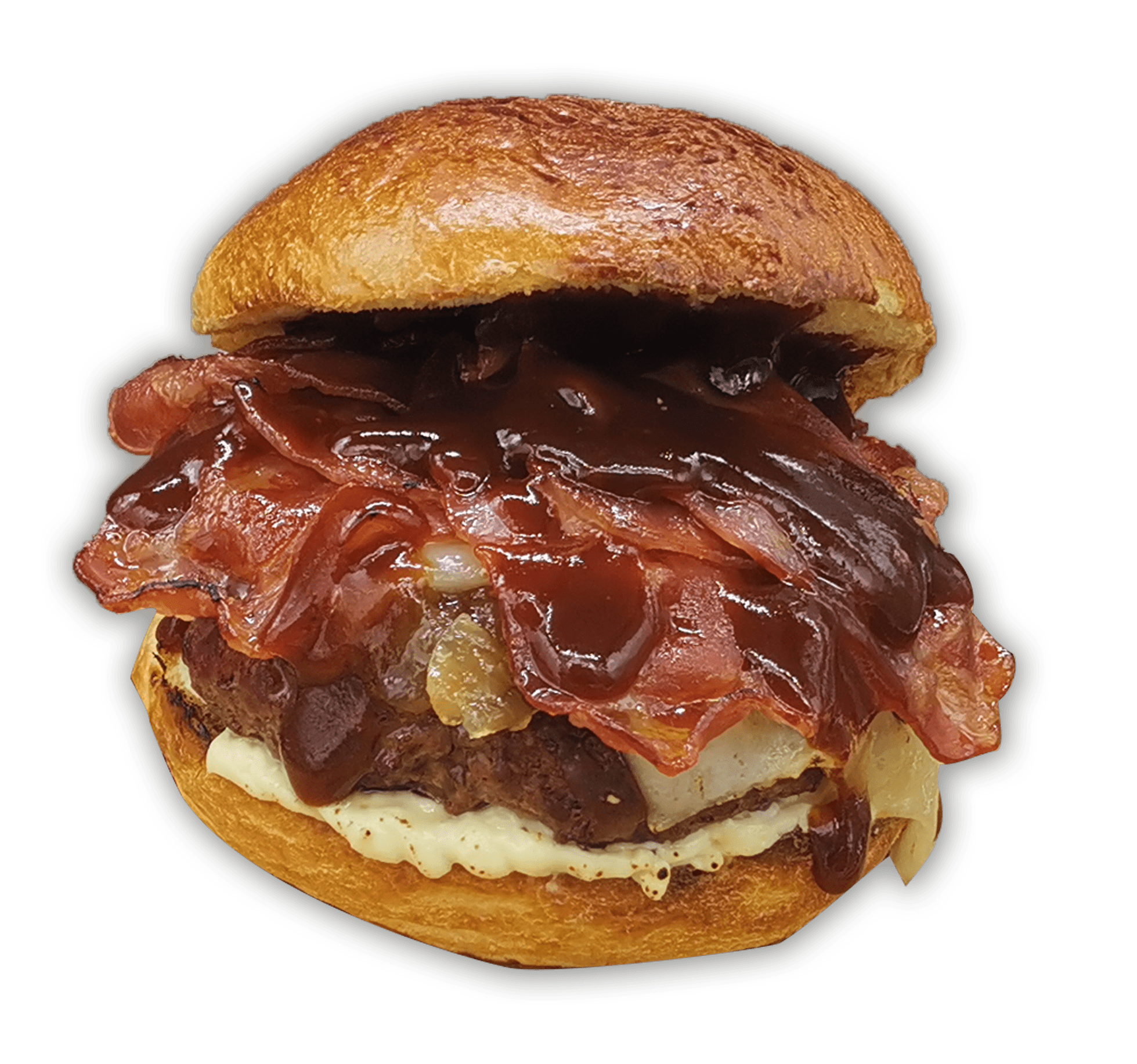 Una hamburguesa con pan tostado, cubierta con queso derretido, tiras de tocino crujientes y rociada con una salsa barbacoa oscura. El pan de abajo tiene una capa de salsa cremosa. La imagen se centra en la hamburguesa, evocando la sabrosa satisfacción que recuerda a los tacos de cochinita pibil.